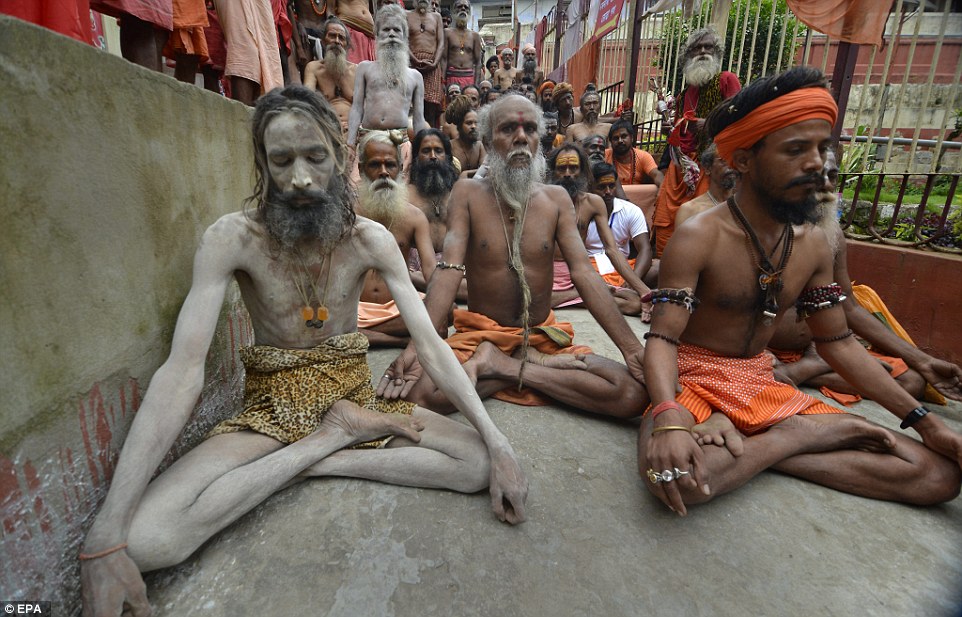 Naga Sadhus or holy men perform Yoga on the first International Day of Yoga in Kamakhya temple in Guwahati city, India