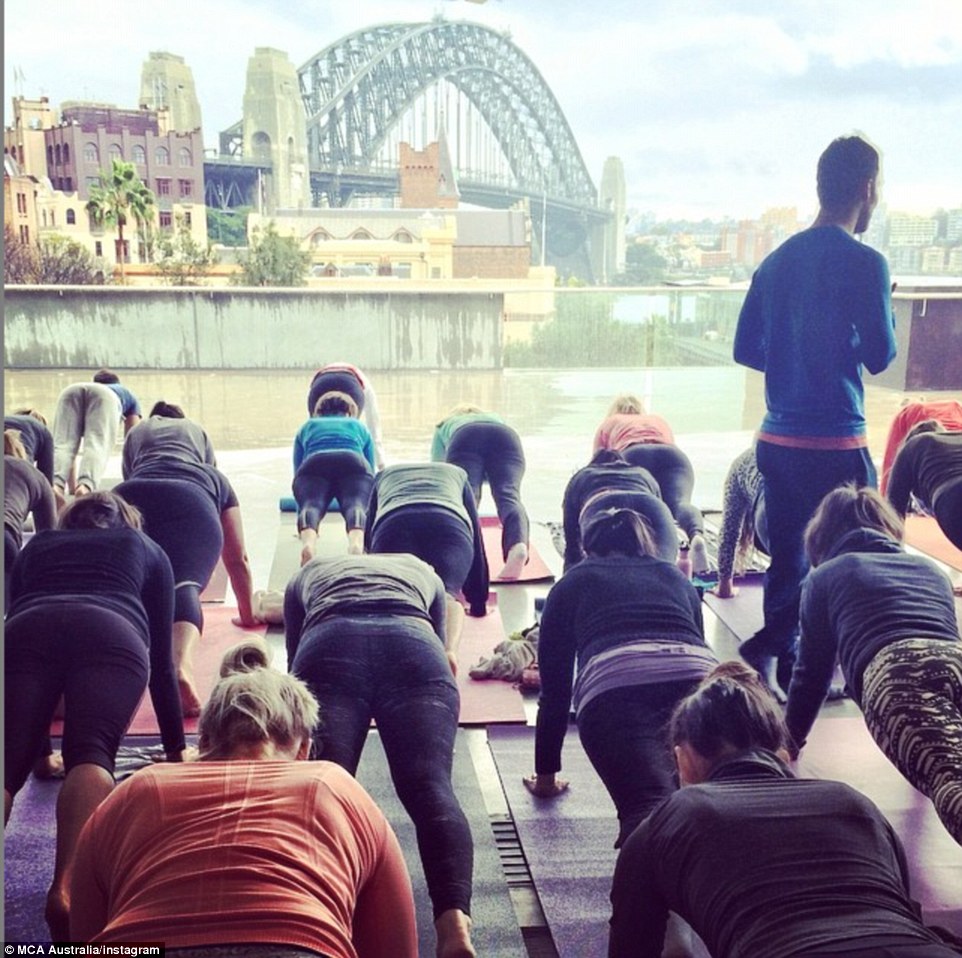 Namaste, world! Sydney says good morning at the Museum of Modern Art as they take part in the Internation Day of Yoga, facing the Harbour Bridge and Opera House