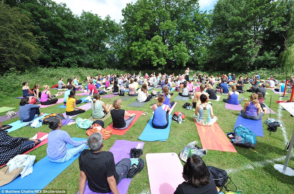 Rows of colourful mats decorated the grass as yoga-enthusiasts stretched in the sunshine