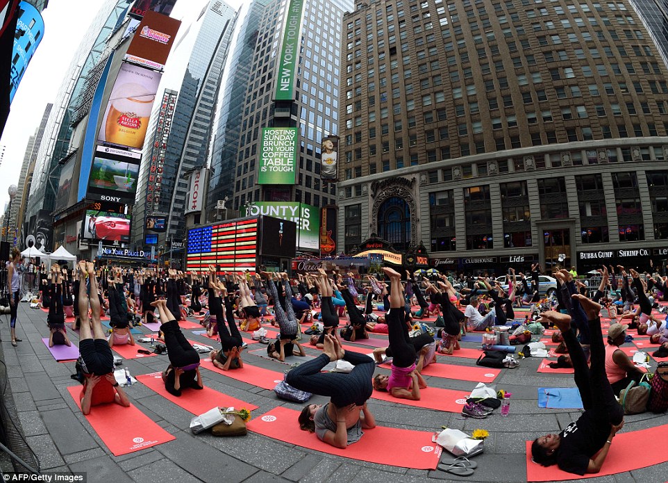 New York's Times Square was packed full of yoga fans, against the background of billboards and sky-scrapers