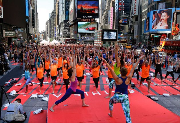 Several hundred yogis practice yoga during the 13th annual Solstice in Times Square event, Sunday, June 21, 2015, in New York. The event drew several thousand people to mark the summer solstice. Photo: Julie Jacobson, AP / AP