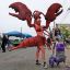 Katherine Gates, left, as a Lobster, and her daughter Lucy Warner, 8, as a mermaid, pose for photographers in the staging area,  Saturday, June 20, 2015, in New York's Coney Island. The parade, which began in 1983 and takes place on the Saturday closest to the first day of summer, is a mix of seaside honky-tonk and family fun.